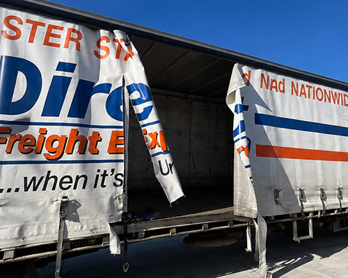Truck curtain repair in progress
